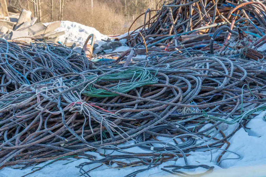 Large pile of recyclable electrical cables and copper wiring at a scrap metal recycling yard in Adelaide.