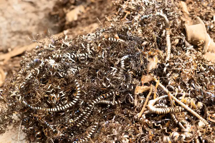 Metal shavings and scrap turnings collected for recycling at a scrap metal facility in Adelaide.