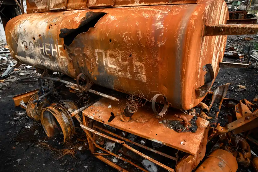 Heavily rusted steel fuel tank awaiting assessment for scrap metal recycling at a licensed recycling yard in Adelaide.